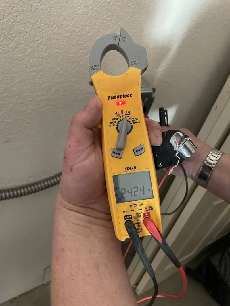 Voltage testing with clamp meter during Electrical Installation Services in Horn Lake